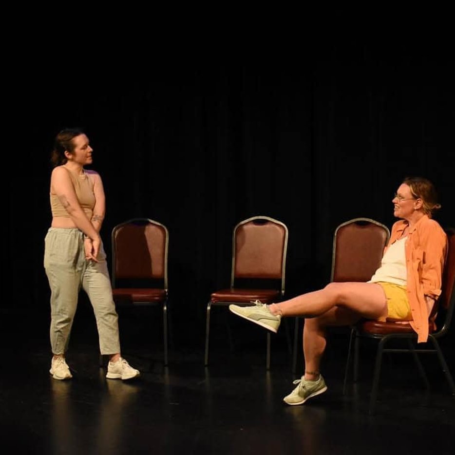 Two actors in mid-scene during festival show