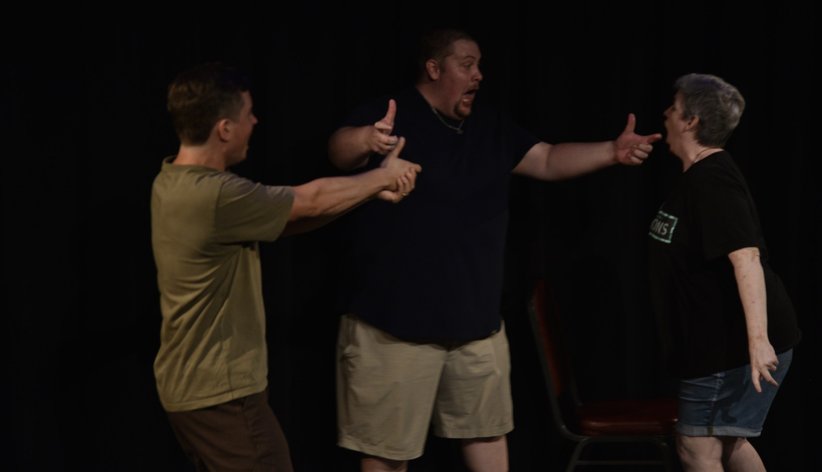 Three performers mid-scene at YAIF 2026