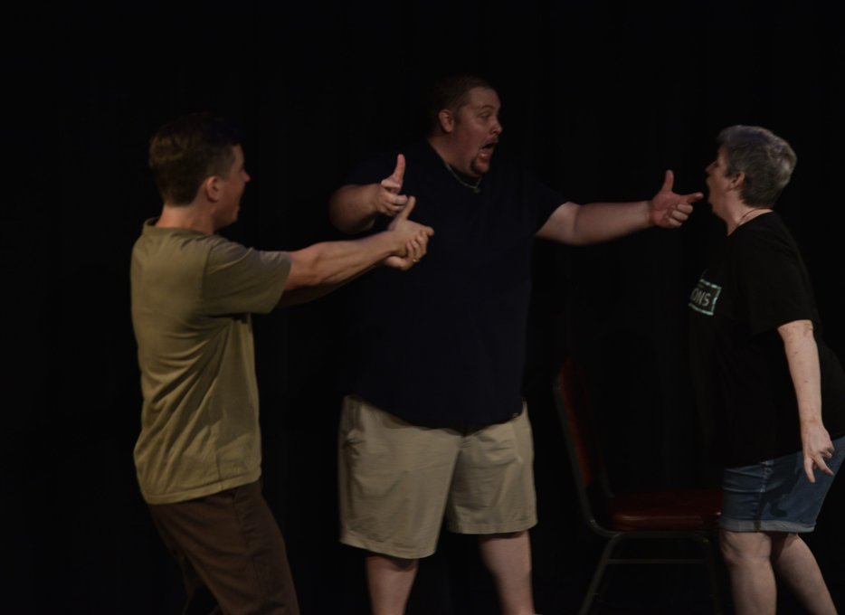Three performers mid-scene at YAIF 2026