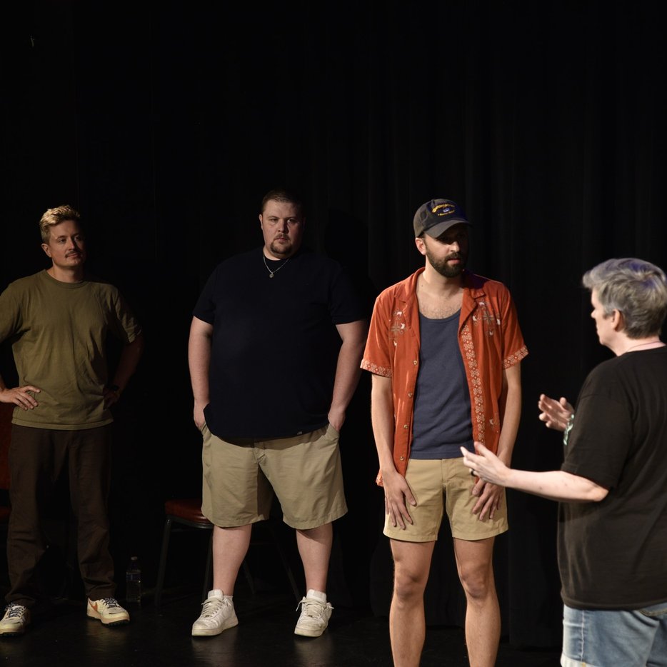 Four improvisers lined up on stage at The Adrienne