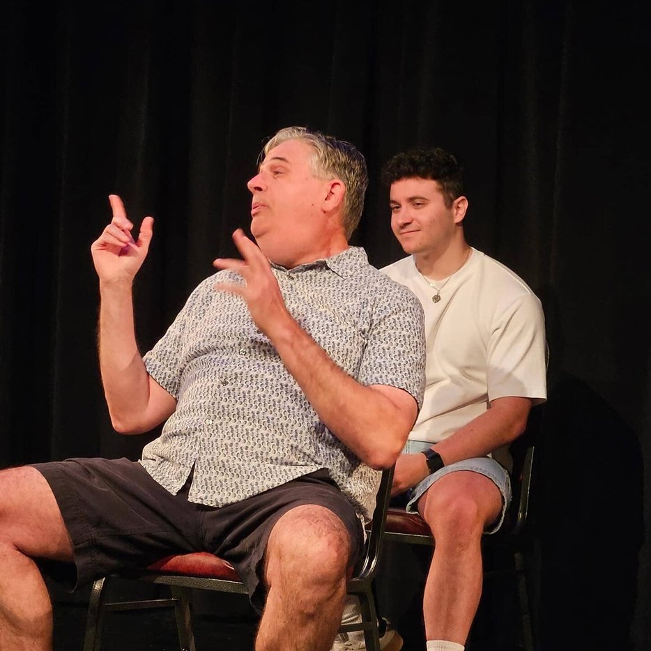 Performers doing group improv skit