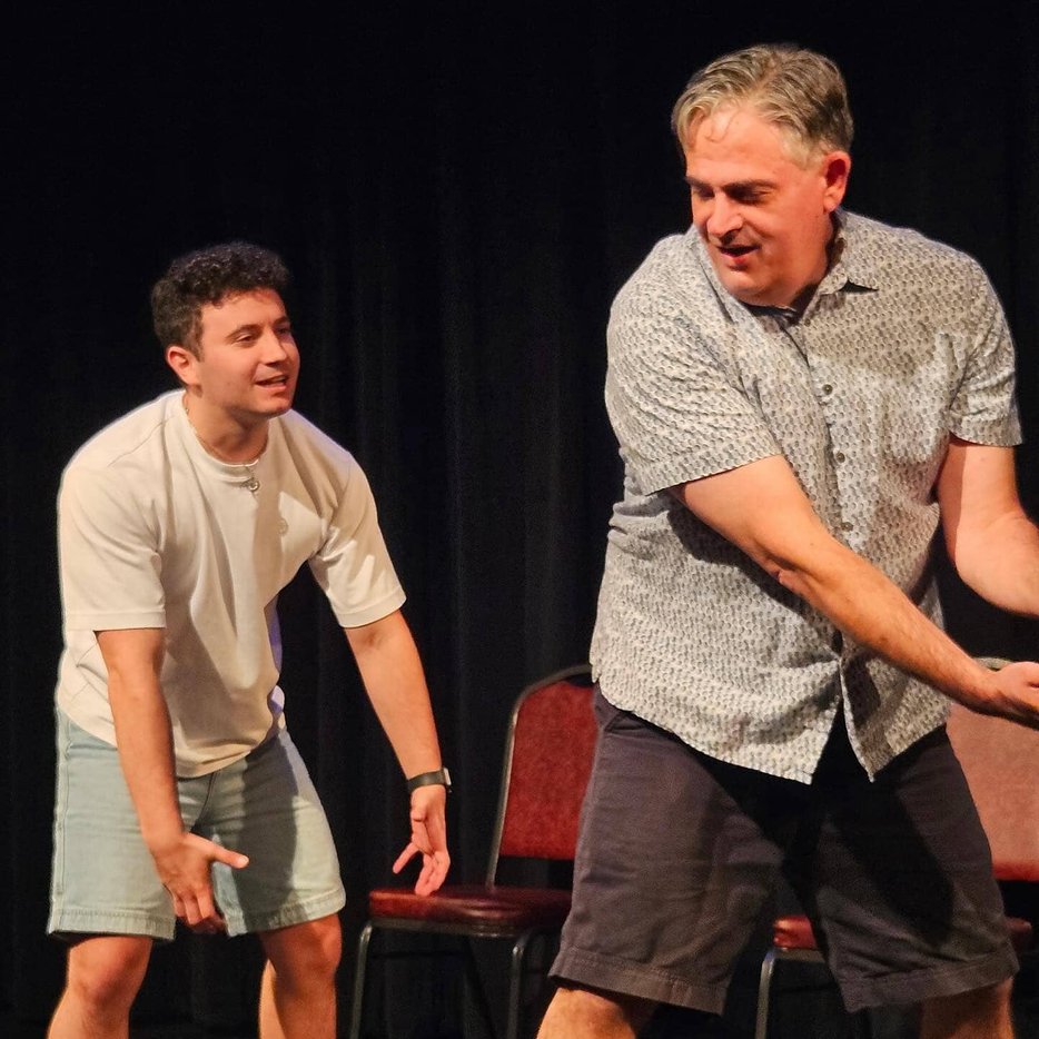 Two comedians reacting in live performance